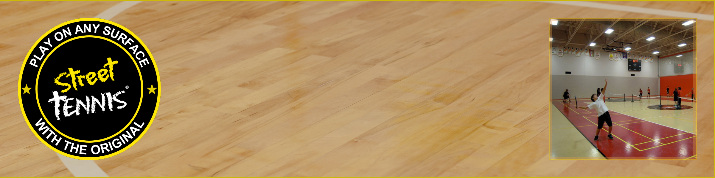 Wooden floor with Street Tennis logo and a small inset of a tennis court in an indoor facility.